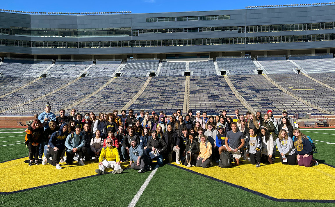 Climate 102 Students pose in the Stadium.