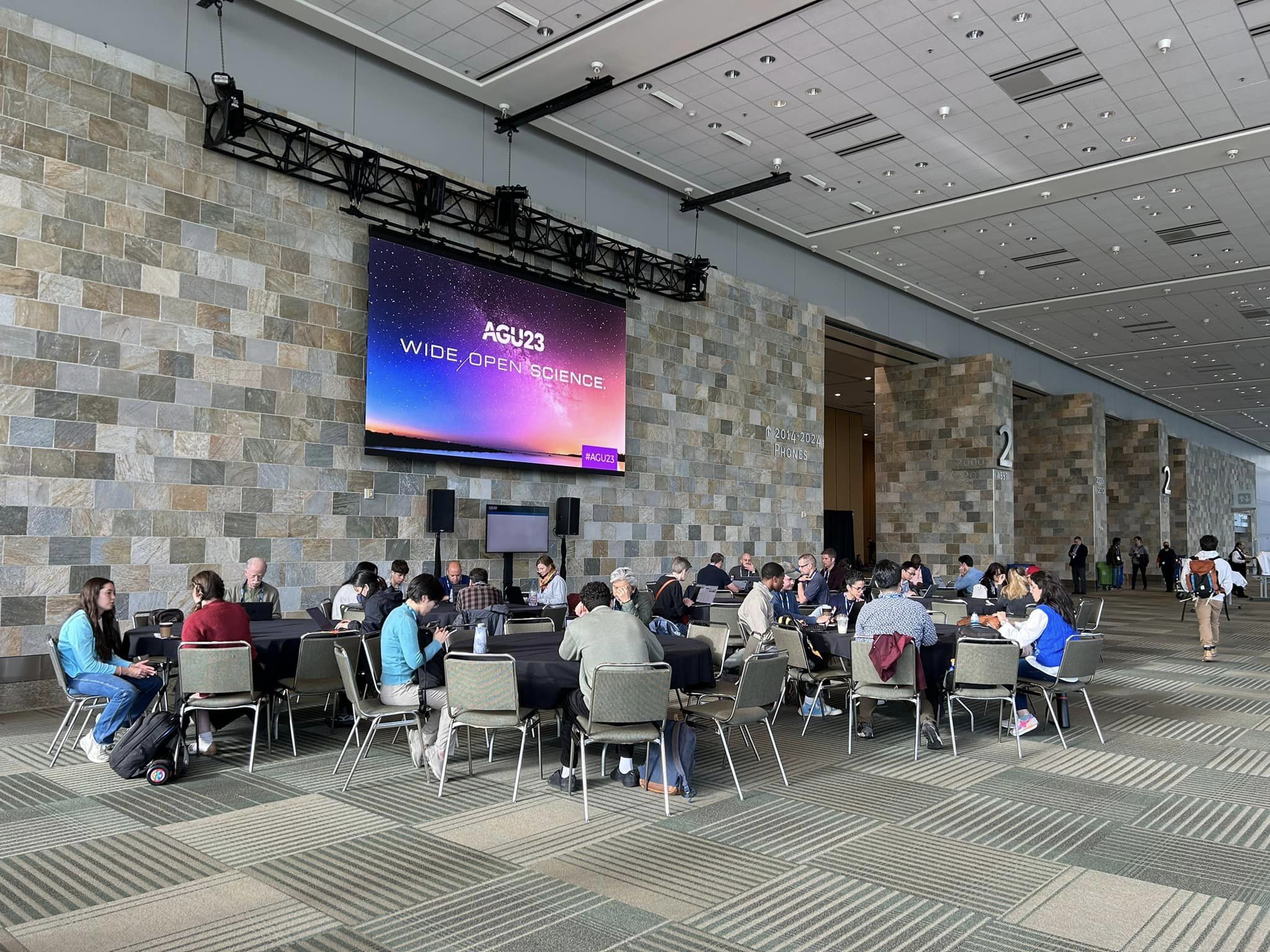 Photo of people gathering at AGU23